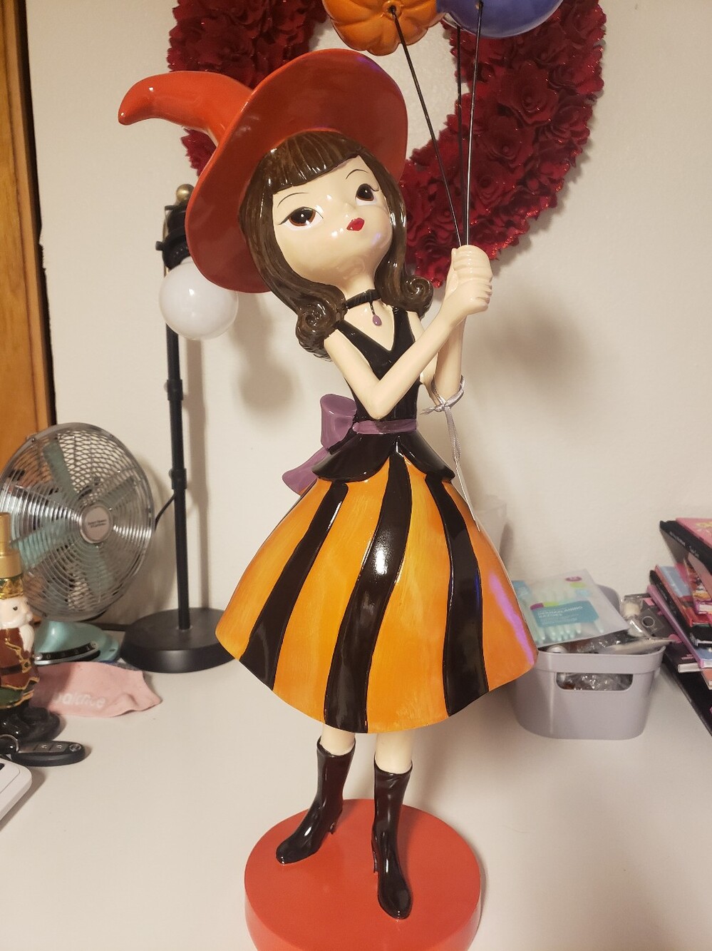 Bella Luxx Orange and Black Witch Girl Figurine With Balloons